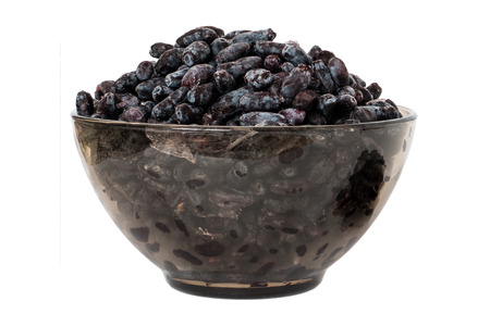 Honeysuckle frozen on a white background in a glass cupの写真素材