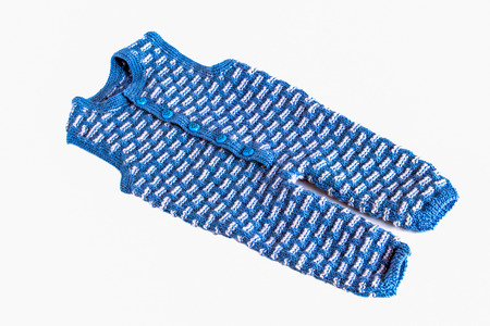 Children's knitted suit on a white background