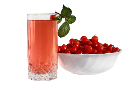 Glass with cherry drink and a cup with cherriesの写真素材