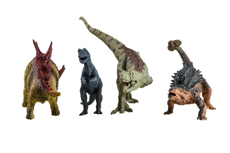 Toy models of dinosaurs on a white backgroundの写真素材