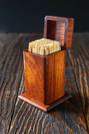 Wooden dental sticks in a wooden boxの写真素材