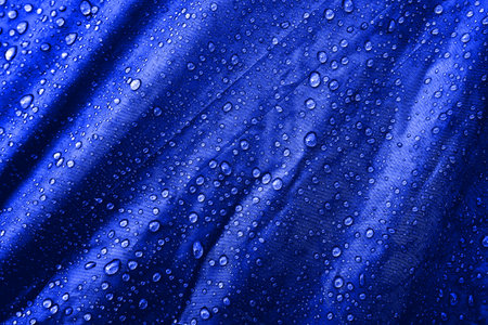 Water drops on the fabric. Water drops on the background. Condensate. Water drops background.の写真素材