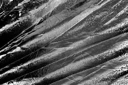 Abstract background. Monochrome texture. Image includes a effect the black and white tones.