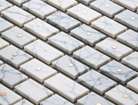 White marble tile floor pattern texture background with gold and silver rivetsの素材