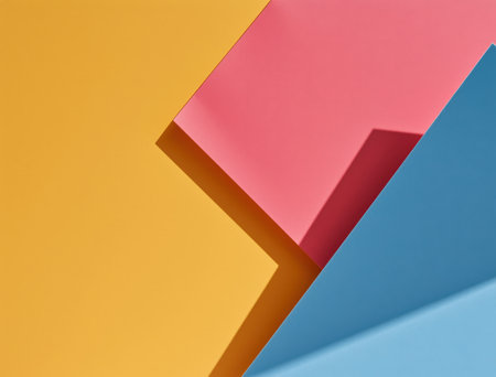 Abstract background presenting a layered composition of yellow, pink, and blue geometric paper shapes with prominent shadows, creating a minimal and modern designの素材