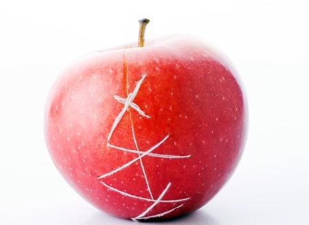apple sewn thread - a symbol of plastic surgeryの写真素材