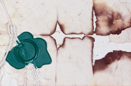 green print on the background of the old burnt paper.の写真素材