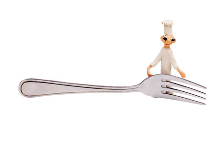 three little cheerful chef made from clay and forkの写真素材