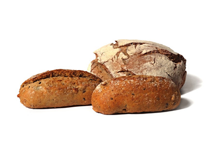 three rustical country style breads with seeds on white backgroundの写真素材