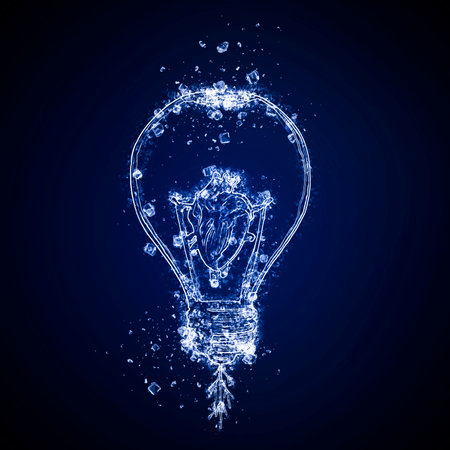 Glowing light bulb with water splashes on dark blue background.の写真素材