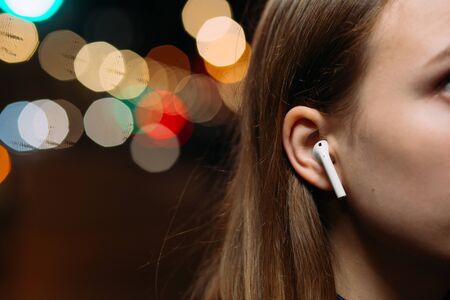girls using  wireless earphones