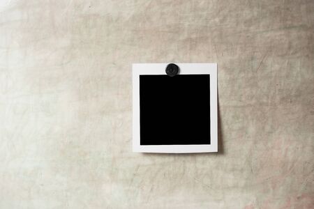 Blank  photo frame with soft shadows and  magnet tape isolated on grey paper background as template for graphic designers presentations, portfolios etc. kids. magnetic board.の写真素材