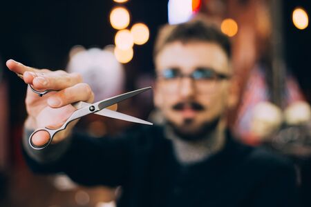 Barber Close-up hairdresser with scissors for cutting hair.の写真素材