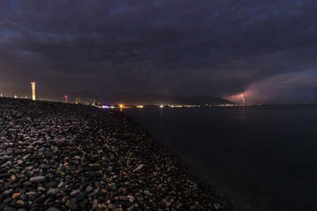 sea view of the city of Adler. rocky coast night shooting. High quality photo