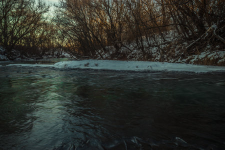 winter landscape on a frozen river in severe frost. High quality photo