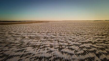 patterns made by wind and snow in the fieldsの写真素材