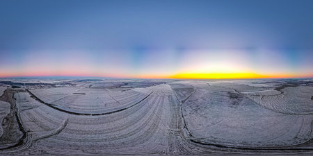 beautiful sunset in a winter frosty field.360