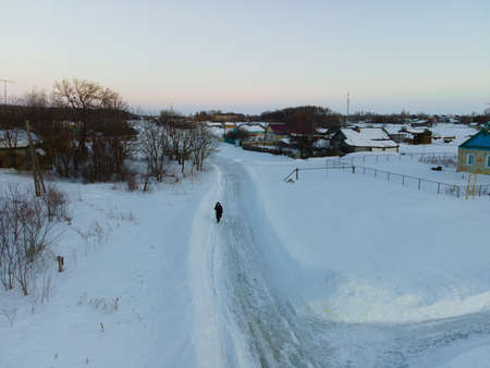 winter village and strolling localsの写真素材