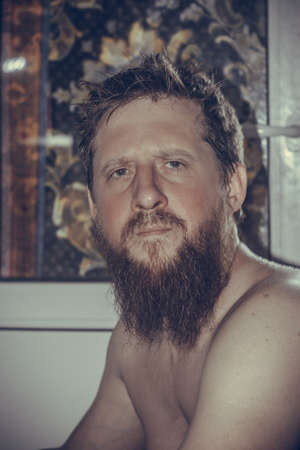 black and white photo of a guy with a beardの写真素材