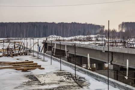 construction of a reinforced concrete bridge in winter.の写真素材