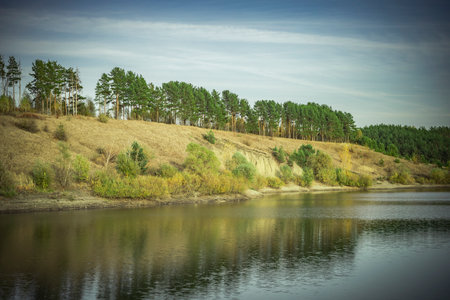 warm autumn on a rural pond.の写真素材