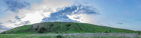 green fields and hills of the countryside.