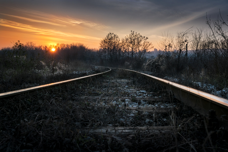 vintage railroad in the sunsetの写真素材