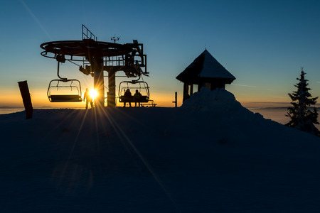 Chair ski lift upper end at sunsetの写真素材