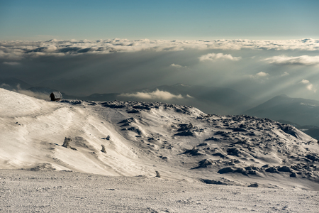 Lonely Cottage high in the Mountain in a snowy Winter Landscape, Mountain Kopaonik, Serbiaの写真素材