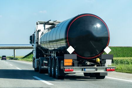 Tank truck on a rural country highway or motorway with light trafficの写真素材