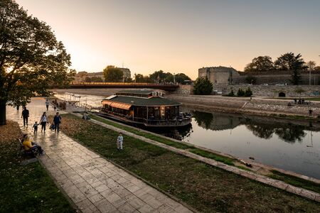 NIS, SERBIA - May 3, 2019: Serbian City if Nis with fortress and University building, at banks of Nisava river at beautiful sunset. Nis is the third largest city of Serbia, Europeのeditorial素材