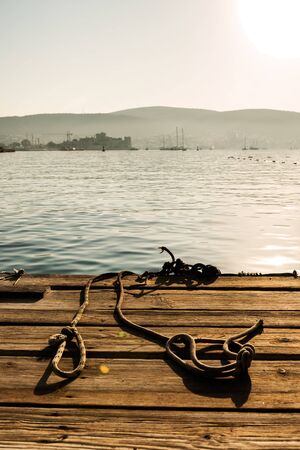 Panoramic Sunrise view of Bodrum Castle and marina bay on Turkish Riviera from old wooden docks....