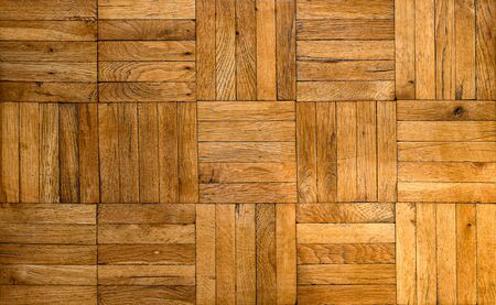 Fragment of old wooden parquet floor. Tileable background of an inlaid mosaique type parquet floor.の写真素材