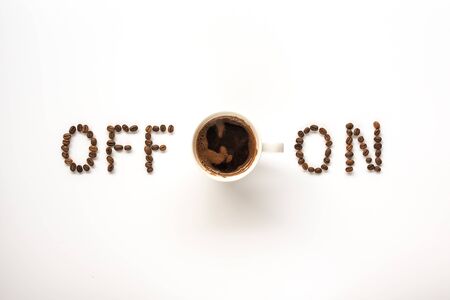 Coffee concept on white background - white hot black coffee cup, top view with On and Off switch about coffee, beans, morning, espresso in cafe, breakfast.の写真素材