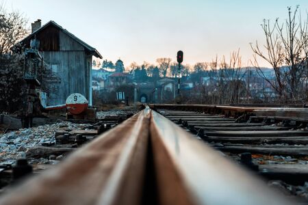 Old railway tracks in the autumn sunsetの写真素材