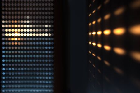 Shutters - blinds with sunlight in the morning. Dark wooden window with blinds. Interior abstract design of living room with window horizontal blinds. Soft focus abstract backgroundの写真素材