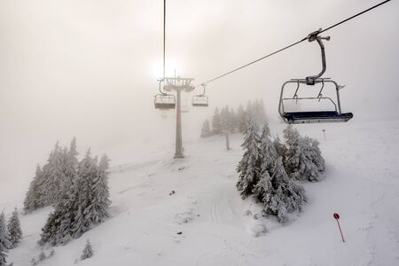 Ski lift on ski resort in winter. Kopaonik, Serbia. Winter landscape