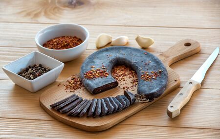 Cut Slices of Special Pirot horseshoe ironed sausage - Peglana Pirotska kobasica, made from veal,...