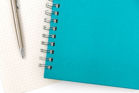 Green Notebook & Pen isolated on white background. Business concept. Business people items. Free space for text.の写真素材