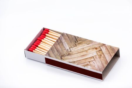 Matches on a white background close-up. Box of matches. Matches made of wood and sulfur. The ignition of matches.の写真素材