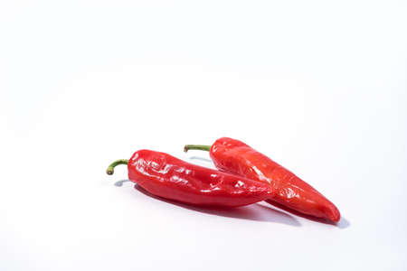 Red chili peppers on white background. Spice for cooking menu in kitchenの写真素材