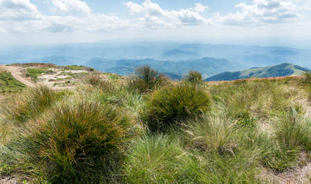 Mountain landscape view. Mountain layers landscape. Meadows and mountains landscape. Blue mountains layers landscape. Top of the Mountainsの写真素材