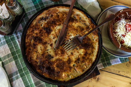 Traditional Serbian pie - layered pita rednica stuffed with cheese and baked in a special pot sacの写真素材