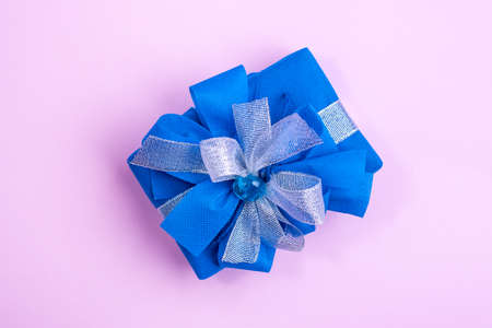 Classic blue surprise gift box with blue and white ribbon, background with copy spaceの写真素材