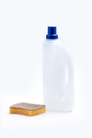 White Detergent plastic bottle with chemical and cleaning sponge on white backgroundの写真素材
