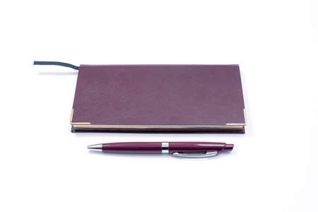 Purple Pen and Purple Cover Notebook on white Backgroundの写真素材