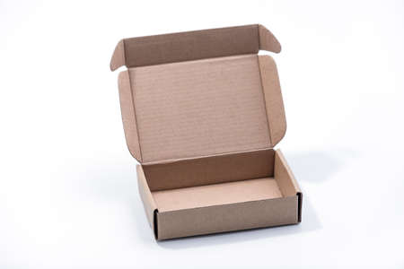 Cardboard Platter box isolated on a yellow background. Carton Packaging Box