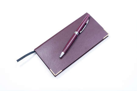 Purple Pen and Purple Cover Notebook on white Backgroundの写真素材