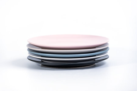 Stack of five colorful empty plates isolated on white background, side view. Black, White, Navy Blue, Grey 

and Pink empty plates collectionの写真素材