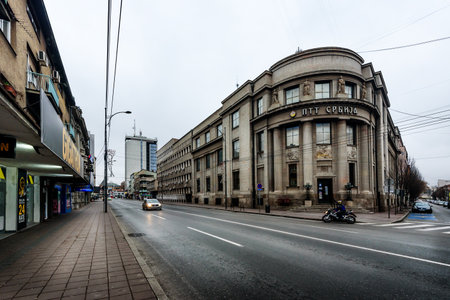 Nis, Serbia - December 13, 2020: Nis with with Post Office building and kight Sunday traffic on a cloudy December day. Nis is the third largest city of Serbia, Europeのeditorial素材